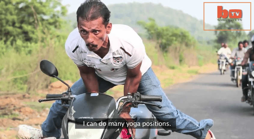 extreme speed yoga striking pose on a bike